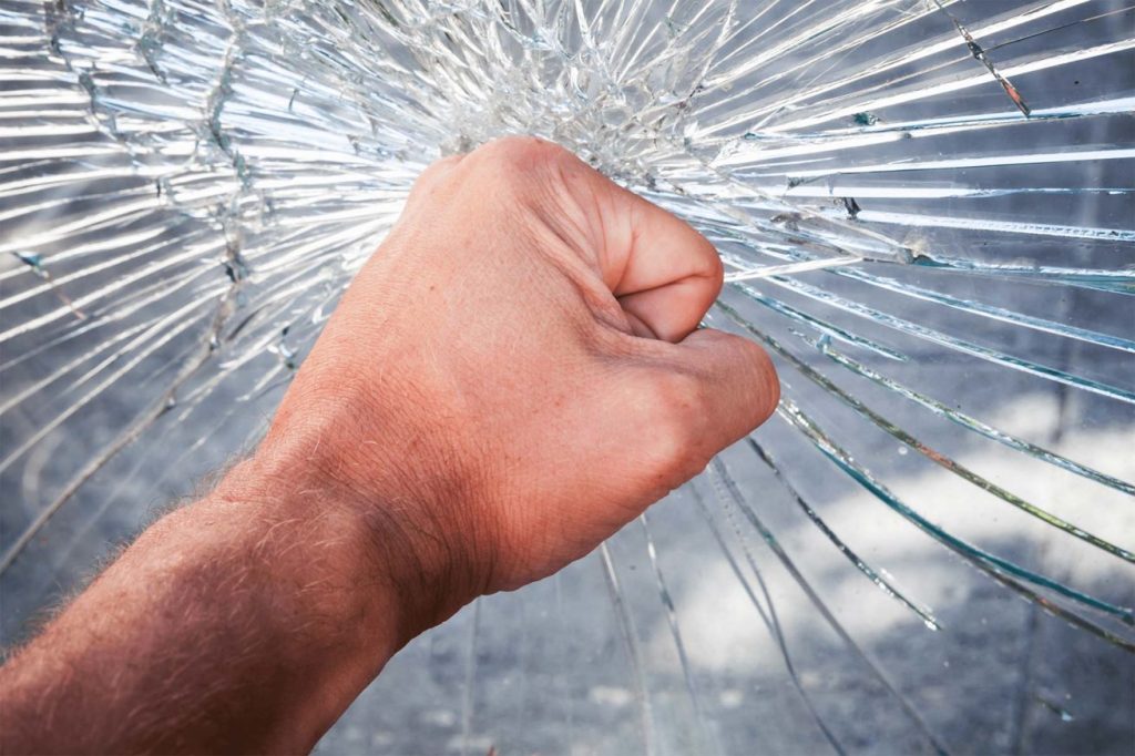 Hand breaking glass